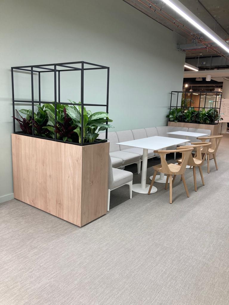texture helps to hive height to these space dividers making the booth feel cosier